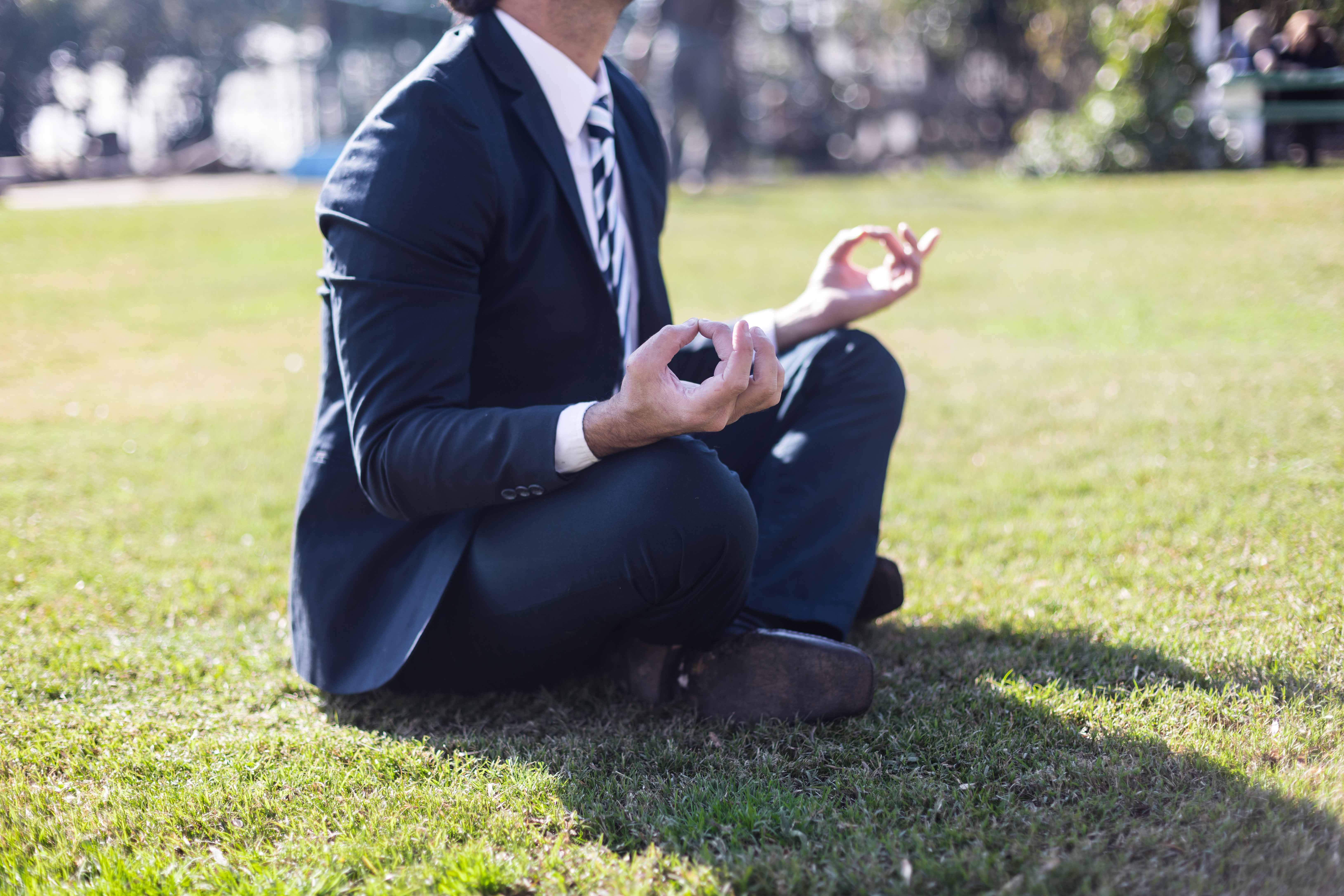 businessman suit practicing yoga