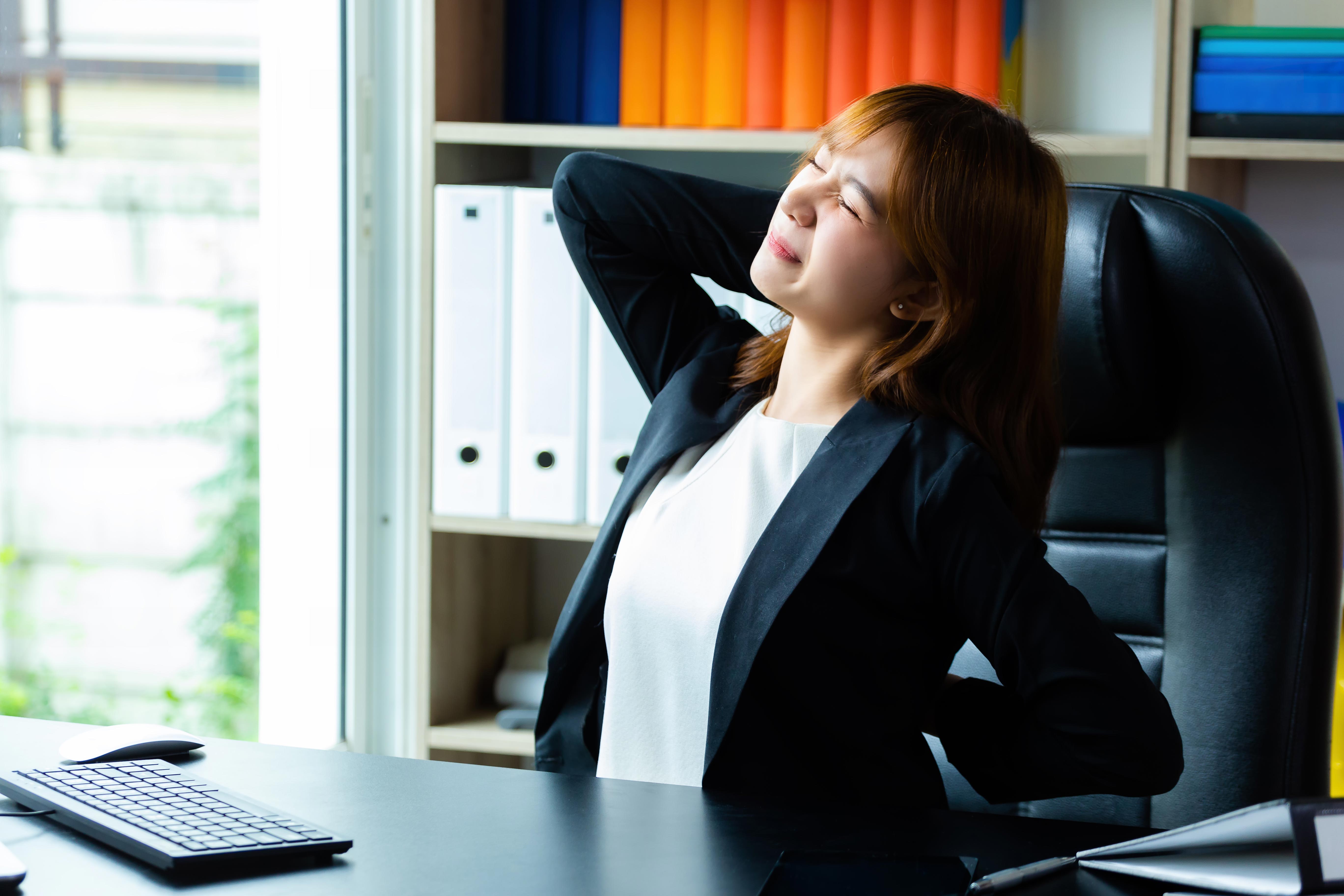 young working woman feel backache office